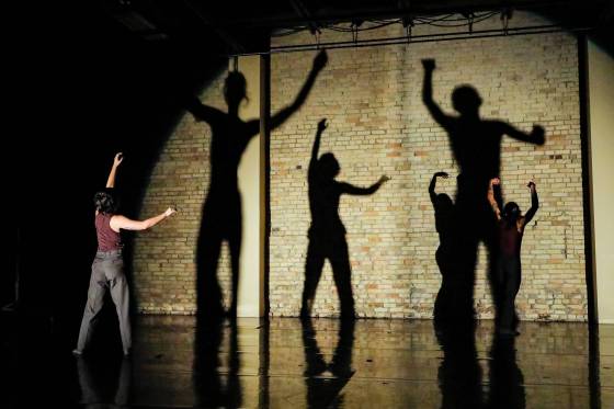 Begin Again, choreographed by Jera Wolfe, makes innovative use of light and shadow in a performance from Winnipeg's Contemporary Dancers. (Leif Norman photo)
