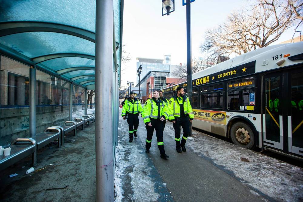 MIKAELA MACKENZIE / FREE PRESS
Transit safety officers walk down Graham Avenue on their first day on the job on Tuesday.