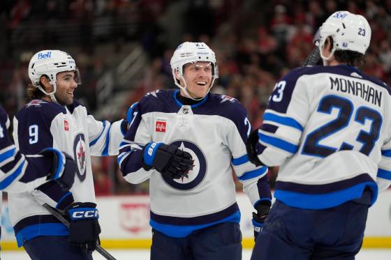 The growing chemistry between Alex Iafallo (left), Nikolaj Ehlers (centre) and Sean Monahan should be on display against the St. Louis Blues tonight. (Erin Hooley / The Associated Press files)