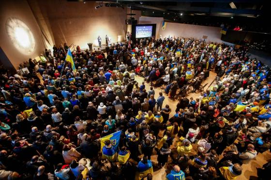 Hundreds attend the Together, We Stand With Ukraine rally Sunday at the Canadian Museum for Human Rights, in a show of continuing support for Ukrainians against Russian aggression. (John Woods / Free Press)