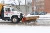 Snow-clearing trucks head north on Donald Street after an overnight storm. (Mike Deal / Free Press)