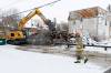 MIKE DEAL / FREE PRESS
                                Crews demolish a building at 149 Spence St. that was destroyed by fire early Monday morning. Winnipeg Fire Paramedic Service crews reported being on scene at the vacant house before 5:20 a.m.