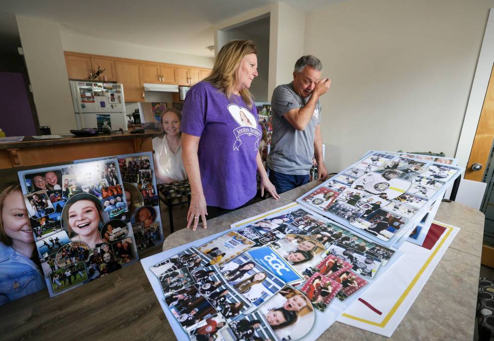 RUTH BONNEVILLE / FREE PRESS FILES
Doug and Karen Reimer, parents of Jordyn Reimer, look over photos and collages they made for some of the tribute events and hockey tournaments that were held in the daughter’s honour.