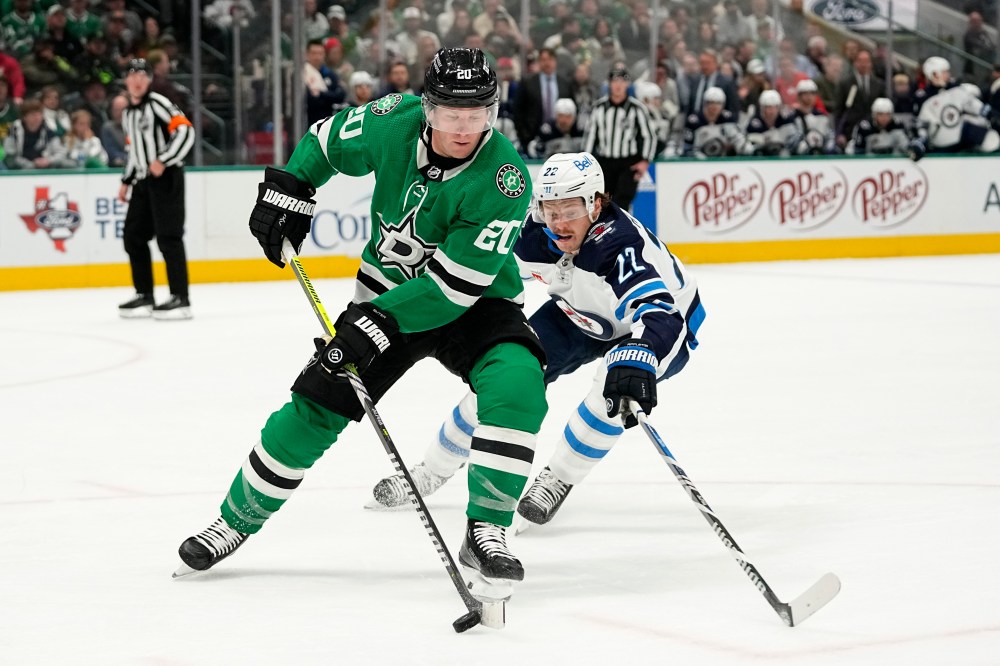Dallas Stars defenceman Ryan Suter controls the puck in front of Winnipeg Jets winger Mason Appleton in the second period. (AP Photo/Tony Gutierrez)