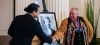 JOHN WOODS / FREE PRESS Premier Wab Kinew and Manitoba Métis Federation president David Chartrand shake hands after unveiling a photo of Louis Riel Day which recognizes him as the first premier of Manitoba at the Manitoba legislature Monday, February 19, 2024.