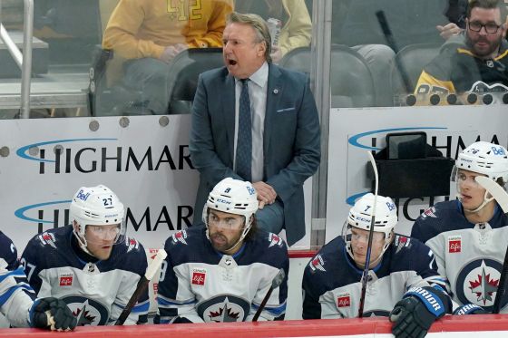Winnipeg Jets head coach Rick Bowness stands behind the bench during the first period of an NHL hockey game against the Pittsburgh Penguins Tuesday in Pittsburgh. (Matt Freed / The Associated Press files)