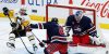 Winnipeg Jets goaltender Connor Hellebuyck (37) saves the shot as Pittsburgh Penguins' Reilly Smith (19) stumbles and Dylan DeMelo (2) defends during third period NHL action in Winnipeg on Saturday, February 10, 2024. THE CANADIAN PRESS/John Woods