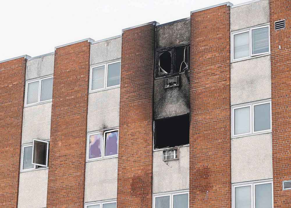 Firefighters were called to the apartment building at 85 Furby St. on Sunday. (John Woods / Winnipeg Free Press)