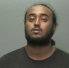 Police ask for help finding 2021 rooming-house shooting suspect