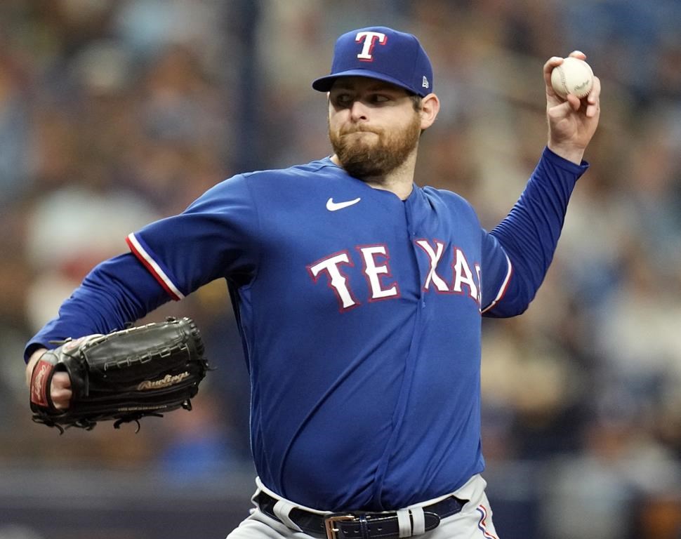 FILE - Texas Rangers starting pitcher Jordan Montgomery throws against the Tampa Bay Rays during the first inning of Game 1 in an AL wild-card baseball playoff series Oct. 3, 2023, in St. Petersburg, Fla. Baseball agent Scott Boras claims the free agent market is intensifying for two-time Cy Young Award winner Blake Snell and left-hander Montgomery with the opening day 3 1/2 weeks away for most teams,“I think there's a pitching panic going on in Major League Baseball right now,” he said Monday, March 4, 2024. (AP Photo/John Raoux, File)