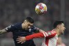 Lazio's Mattia Zaccagni, left, heads the ball past Bayern's Aleksandar Pavlovic during the Champions League round of 16 second leg soccer match between FC Bayern Munich and Lazio at the Allianz Arena stadium in Munich, Germany, Tuesday, March 5, 2024. (AP Photo/Matthias Schrader)