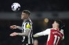 Newcastle's Kieran Trippier, left, and Arsenal's Gabriel Martinelli challenge for the ball during the English Premier League soccer match between Arsenal and Newcastle United at the Emirates stadium in London, England, Saturday, Feb. 24, 2024. (AP Photo/Alastair Grant)