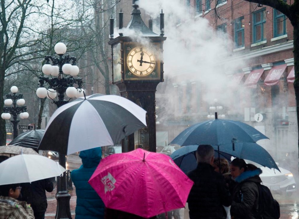 Canadians are changing their clocks tonight as much of the country prepares to spring forward for daylight time, which happens for most of the country at 2 a.m. local time. People walk by the steam clock in Gas Town in downtown Vancouver, B.C., Tuesday, Dec. 31, 2019. THE CANADIAN PRESS/Jonathan Hayward