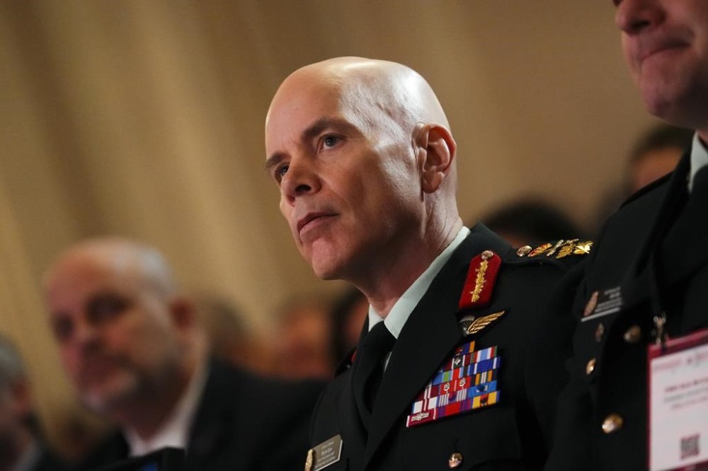The search is on for the next leader of the Canadian Armed Forces — and it's long past time that a woman became chief of the defence staff, observers say. The man currently in the role, Gen. Wayne Eyre, listens as Defence Minister Bill Blair speaks during the Ottawa Conference on Security and Defence in Ottawa on Thursday, March 7, 2024. THE CANADIAN PRESS/Sean Kilpatrick