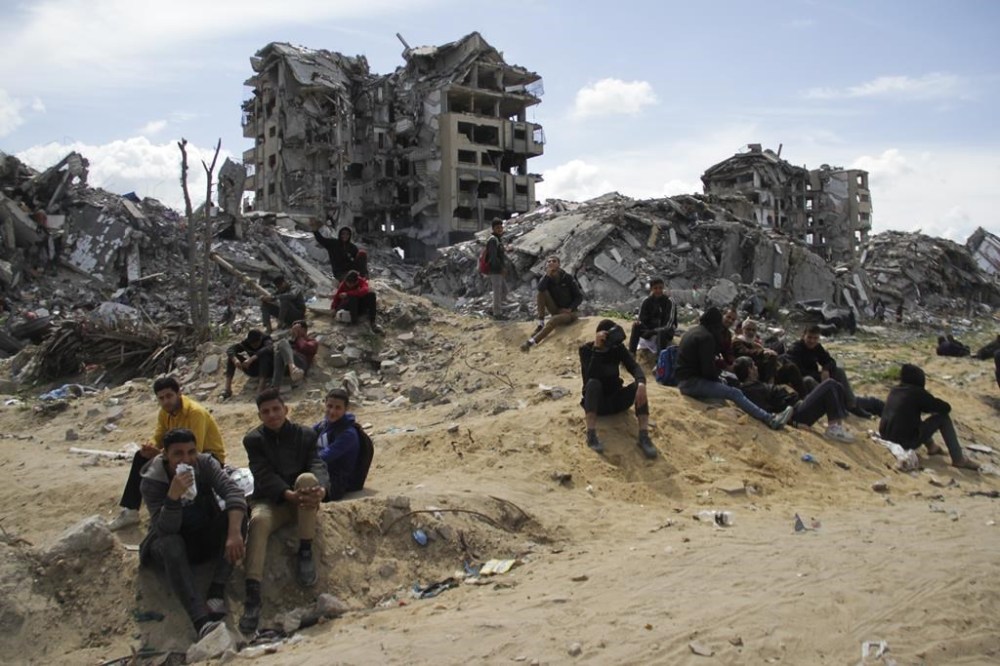 Palestinians wait for the humanitarian aid to be dropped by the U.S. Air Force in Gaza City, Gaza Strip, on Saturday, March 9, 2024. (AP Photo/Mahmoud Essa)
