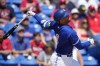 Toronto Blue Jays' George Springer watches a fly ball in the first inning of a spring training baseball game against the Philadelphia Phillies Monday, March 4, 2024, in Dunedin, Fla. George Springer and Dasan Brown had two runs each as the Toronto Blue Jays rolled to a 13-5 win over the Philadelphia Phillies in spring training action on Saturday. THE CANADIAN PRESS/AP, Charlie Neibergall