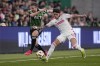 Austin FC forward Jon Gallagher (17) and St. Louis City midfielder Celio Pompeu (12) chase a pass during the first half of an MLS soccer match Saturday, March 9, 2024, in Austin, Texas. (AP Photo/Eric Gay)