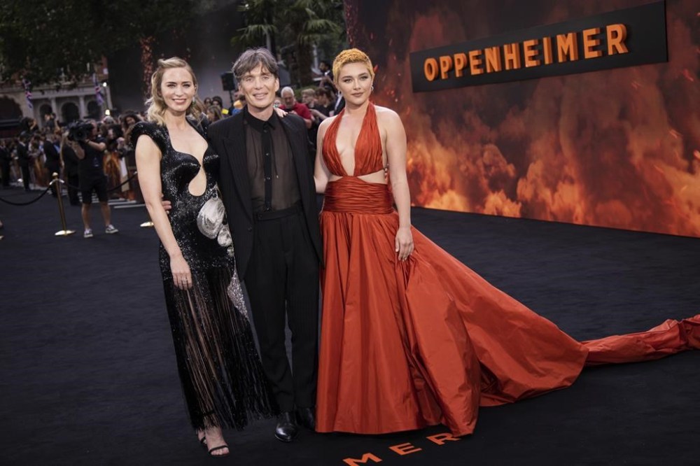 Emily Blunt, from left, Cillian Murphy and Florence Pugh pose for photographers at the premiere for the film