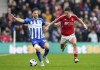 Brighton and Hove Albion's Joel Veltman, left, and Nottingham Forest's Nicolas Dominguez battle for the ball during the English Premier League soccer match between Brighton and Hove Albion and Nottingham Forest at the American Express Stadium, Brighton, England, Sunday March 10, 2024. (Zac Goodwin/PA via AP)