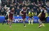West Ham United's Danny Ings, left, celebrates scoring their side's second goal of the game during the English Premier League soccer match between Burnley FC and West Ham United at the London Stadium in London, Sunday March 10, 2024. ( John Walton/PA via AP)