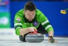 Saskatchewan skip Mike McEwen delivers a rock while playing Team Alberta-Bottcher during the semifinal at the Brier, in Regina, on Sunday, March 10, 2024. THE CANADIAN PRESS/Darryl Dyck