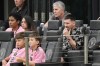 Inter Miami forward Lionel Messi, right, watches from his sideline box during the first half of an MLS soccer match against CF Montreal, Sunday, March 10, 2024, in Fort Lauderdale, Fla. (AP Photo/Rebecca Blackwell)