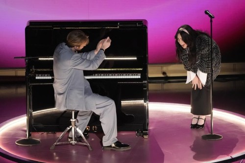 Finneas, left, and Billie Eilish perform 