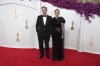 Christopher Nolan, left, and Emma Thomas arrive at the Oscars on Sunday, March 10, 2024, at the Dolby Theatre in Los Angeles. (Photo by Jordan Strauss/Invision/AP)