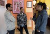 France Nelson Gideon, left, Wedne Colin and Hakeem Formonvil, right, employees at the Maison d'Haiti, chat about the situation back in Haiti, Monday, March 11, 2024, in Montreal. THE CANADIAN PRESS/Ryan Remiorz