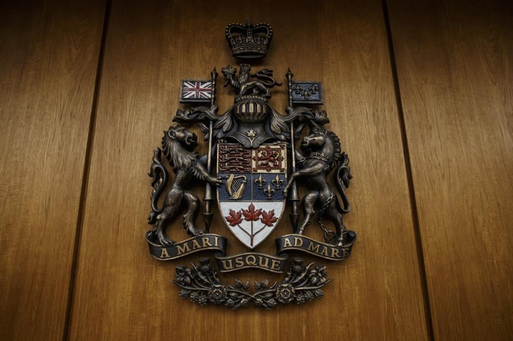 The federal advocate for victims of crime is investigating how Canada’s justice system treats sexual assault survivors. The federal coat of arms are shown in a courtroom at the Edmonton Law Courts building, in Edmonton on June 28, 2019. THE CANADIAN PRESS/Jason Franson