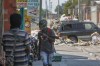 Armed members of the G9 and Family gang stand guard at their roadblock in the Delmas 6 neighborhood of Port-au-Prince, Haiti, Monday, March 11, 2024. Prime Minister Justin Trudeau has spoken with Haiti's prime minister about the ongoing humanitarian, security, and political crises in that country. THE CANADIAN PRESS/AP, Odelyn Joseph