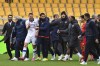 Verona's Thomas Henry, in white, leaves the pitch after the Serie A soccer match between U.S. Lecce and Hellas Verona FC at Via del Mare Stadium, Lecce, Italy, Sunday March 10, 2024. Lecce coach Roberto D’Aversa, foreground right, head butted Hellas Verona striker Thomas Henry following a heated matchup between two teams just above the relegation zone in Serie A on Sunday. (Giovanni Evangelista/LaPresse via AP)