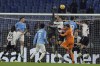 Udinese's goalkeeper Maduka Okoye, back center, and Lazio's goalkeeper Ivan Provedel, front right, in action during a Serie A soccer match between Lazio and Udinese, at Rome's Olympic Stadium, Monday, March 11, 2024. (Alfredo Falcone/LaPresse via AP)
