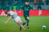 Saarbrucken's Manuel Zeitz, left, and Monchengladbach's Franck Honorat battle for the ball during the German Cup quarterfinal soccer match between FC Saarbrucken and Borussia Monchengladbach at Ludwigspark Stadium, Saarbrucken, Germany, Tuesday March 12, 2024. (Uwe Anspach/dpa via AP)