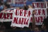 Marseilles fans hold up banners saying 