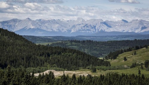 A section of the eastern slopes of the Canadian Rockies is seen west of Cochrane, Alta., Thursday, June 17, 2021. Alberta's utitilies regulator has released a report saying the renewables industry poses little threat to agriculture or the environment. The Alberta Utilities Commission also say there's no consensus on what landscapes should be protected for their scenic value. THE CANADIAN PRESS/Jeff McIntosh