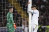 Napoli's Jesper Lindstrom, right, reacts after a missed scoring opportunity during the Champions League, round of 16, second leg soccer match between Barcelona and SSC Napoli at the Olympic Lluis Companys stadium in Barcelona, Spain, Tuesday, March 12, 2024. (AP Photo/Emilio Morenatti)