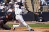 New York Yankees' Juan Soto hits a single in the first inning of a spring training baseball game against the Atlanta Braves Sunday, March 10, 2024, in Tampa, Fla. (AP Photo/Charlie Neibergall)