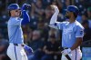 Kansas City Royals' Bobby Witt Jr. celebrates his home run with teammate MJ Melendez, right, during the third inning of a spring training baseball game against the Oakland Athletics, Friday, March 1, 2024, in Surprise, Ariz. (AP Photo/Lindsey Wasson)