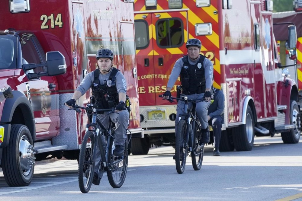 Bicycle-mounted police patrol near the federal courthouse before the arrival of former President Donald Trump, Thursday, March 14, 2024, in Fort Pierce, Fla. (AP Photo/Wilfredo Lee)