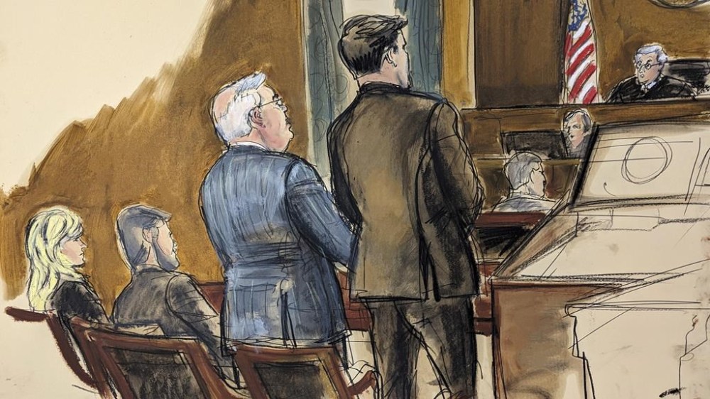 FILE - Sen. Bob Menendez, left, stands at his arraignment in front of Judge Sidney Stein, far right, with his defense attorney Adam Fee, center, in Manhattan federal court, March 11, 2024, in New York. Menendez's wife, Nadine Menendez, far left, looked on. Sen. Menendez cannot escape federal prosecution on grounds that he has legislative immunity from four charges alleging that he accepted bribes including cash and gold bars in exchange for delivering favors to three New Jersey businessmen, Judge Stein ruled Thursday, March 14, 2024. (Elizabeth Williams via AP)