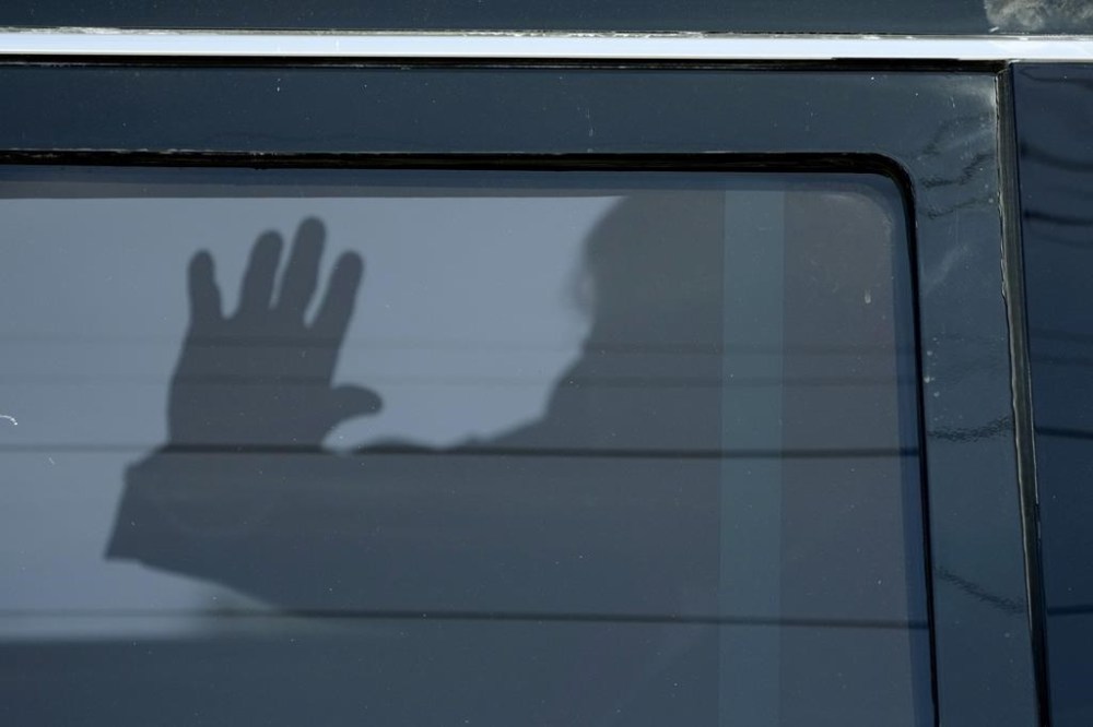 Former President Donald Trump waves to supporters as he leaves federal court, Thursday, March 14, 2024, in Fort Pierce, Fla. (AP Photo/Wilfredo Lee)