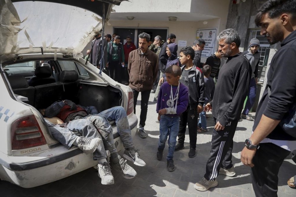 Palestinians killed in an Israeli airstrike are brought into Shifa Hospital in Gaza City on Friday, March 15, 2024. (AP Photo/Mohammed Hajjar)