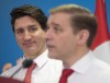 N.L. Premier Andrew Furey takes questions from reporters as Prime Minister Justin Trudeau looks on, in Clarenville N.L. on March 15, 2023. THE CANADIAN PRESS/Paul Daly
