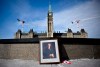 A framed portrait of former prime minister Brian Mulroney leans against the Centennial Flame on Parliament Hill 
as Canadians mourn his death at the age of 84, in Ottawa, on Friday, March 1, 2024. THE CANADIAN PRESS/Justin Tang