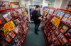 Glen Fuhl, president and CEO of Video King, is photographed as he organizes shelves in one of his stores in Winnipeg Thursday, March 7, 2024. Fuhl is planning to close up shop after forty years in the movie business. April 6 will be the day he turns off the lights for good. THE CANADIAN PRESS/John Woods