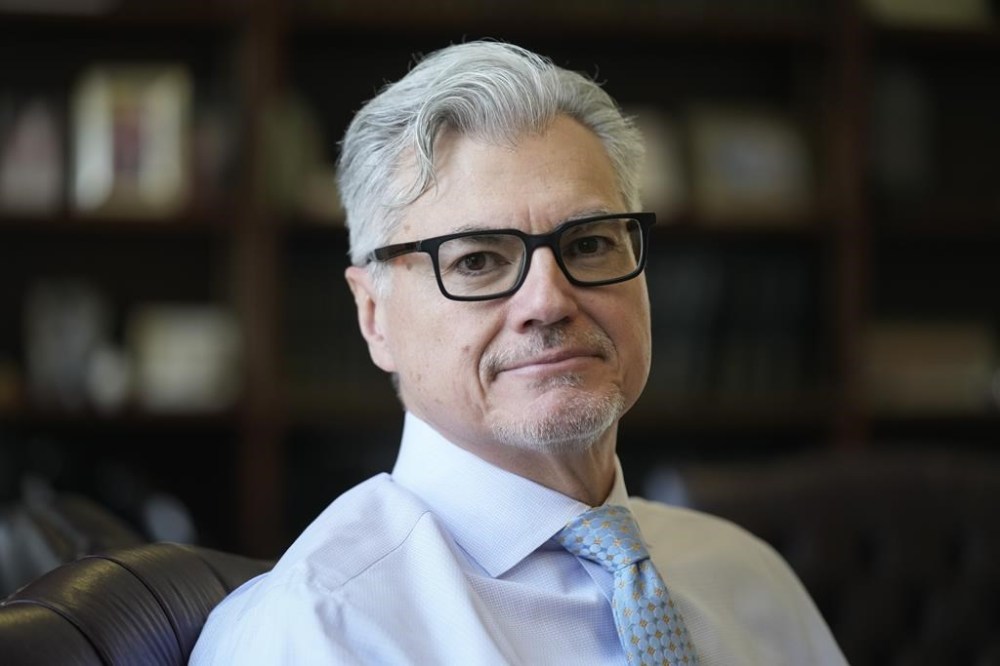 Judge Juan Merchan poses for a picture in his chambers in New York, Thursday, March 14, 2024. Merchan is poised to become the first judge ever to oversee a former U.S. president’s criminal trial. He's presiding over Donald Trump’s hush money case in New York. (AP Photo/Seth Wenig)