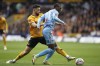 Wolverhampton Wanderers' Max Kilman, left and Coventry City's Haji Wright vie for the ball, during the English FA Cup quarter final match soccer match between Wolverhampton and Coventry City, at the Molineux, Wolverhampton, England, Saturday, March 16, 2024. (Mike Egerton/PA via AP)
