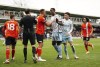 Luton Town's Carlton Morris, centre left and Nottingham Forest's Willy Boly exchange words, during the English Premier League soccer match between Luton Town and Nottingham Forest, at Kenilworth Road, in Luton, England, Saturday March 16, 2024. (Zac Goodwin/PA via AP)