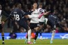 Tottenham Hotspur's Destiny Udogie, left, and Yves Bissouma, right, battle for the ball with Fulham's Sasa Lukic, center, during a Premier League soccer match between FC Fulham and Tottenham Hotspur in London, England, Saturday, March 16, 2024. (Adam Davy/PA via AP)